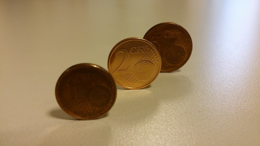 Coins and digital investment representative image for digital gold investor caution report