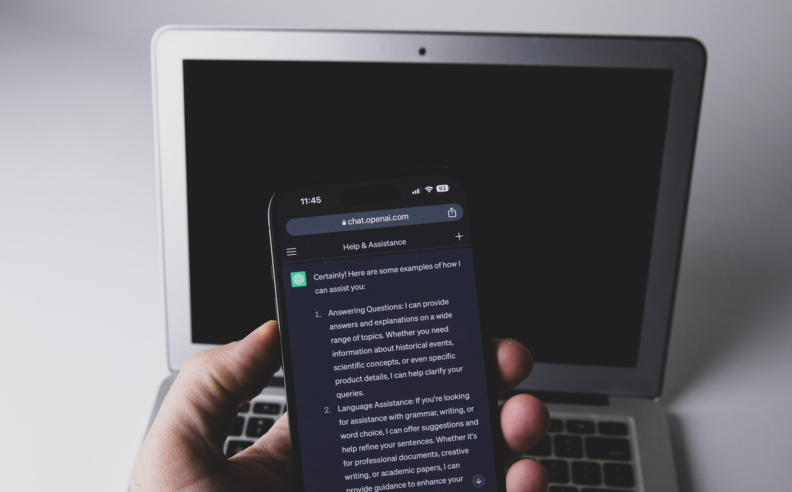 Smartphone with AI app representative image for AI technology news