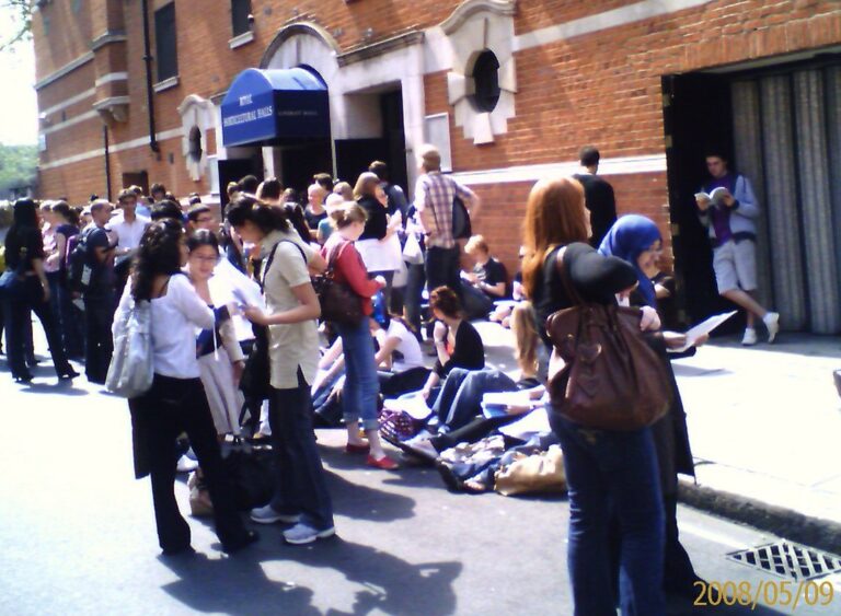 Exam hall with students for education and employment news
